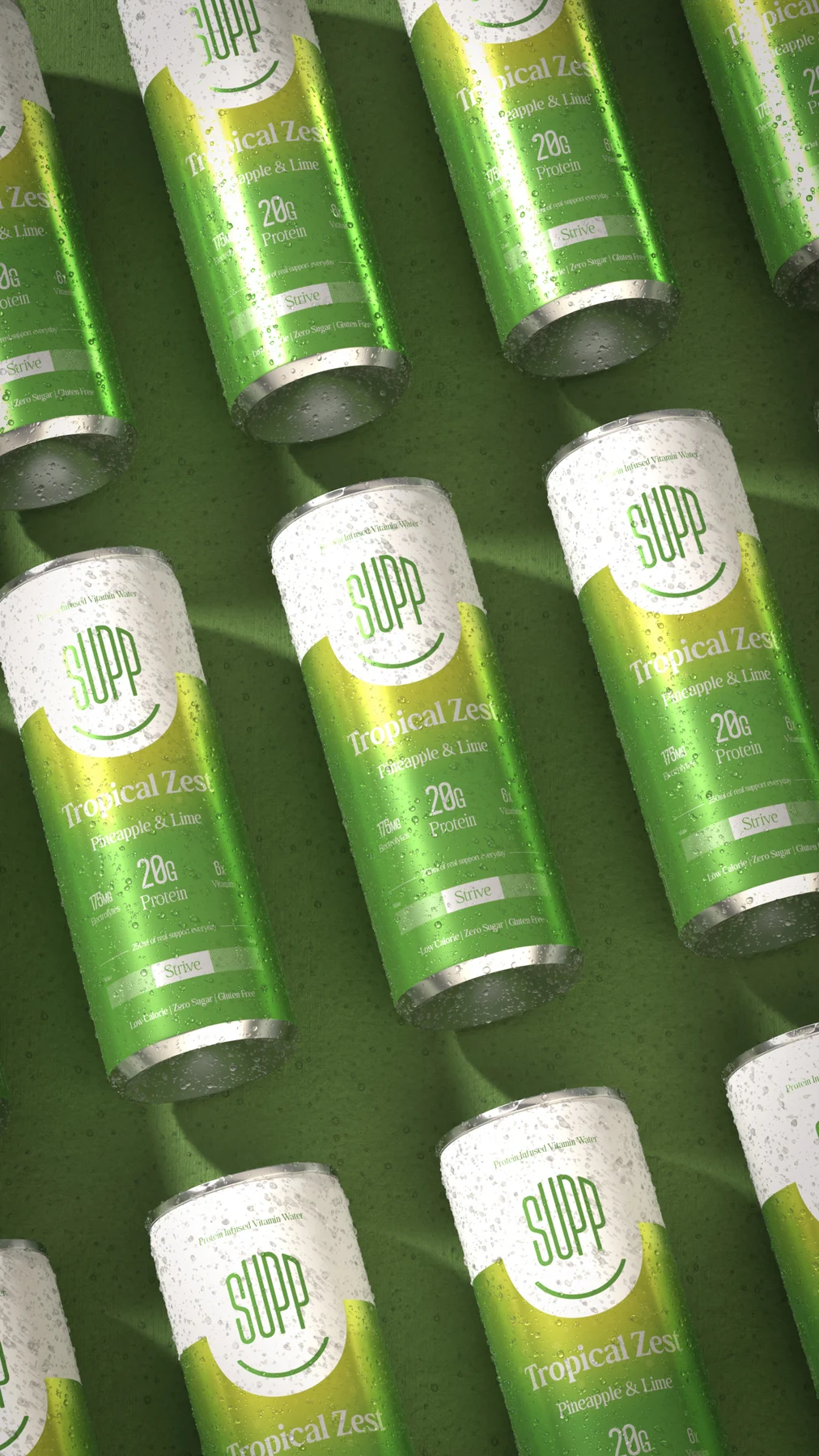 Rows of Supp Tropical Zest cans covered in condensation, laid in a diagonal pattern on green